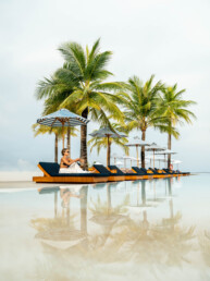 Model relaxing by private pool in Maldives